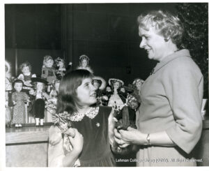 Actress Patty Duke talks to a girl of indeterminate age
