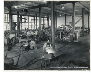 Image of a factory floor with machines, welding, and assembly appearing to be taking place.