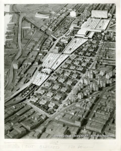 Image of an overheard view of a proposed planffor decking for the New York Central Railroad yards. Visible items include the Major Deegan Expressway, Yankee Stadium, the County Building, Cardinal Hayes H.S., the 149th St. Post Office, Patterson Houses, and the Melrose Central building of the New York Central Railroad.