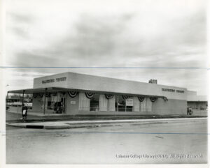 Image of a suburban-style bank branch, surrounded by a road