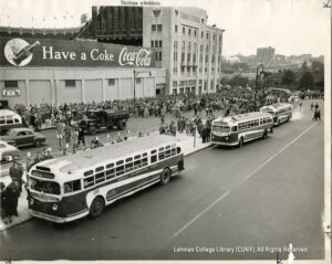 Image of two buses and crowds of people outside Yankee Stadium
