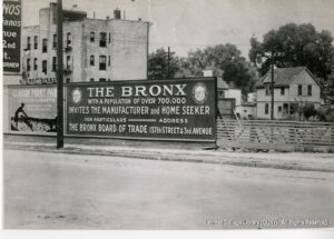 Image of a billboard advertising Clason Point Park as Clean and Delightful. Another billboard says "The Bronx, with a population of over 700,0000 invites the manufacturer and home seeker for particuarls, address teh Bronx Board of Trade, 137th Street and Third Avenue."