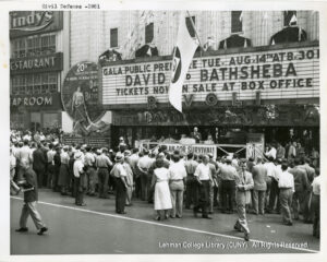 Image of a crowd gathered in front of a theater.